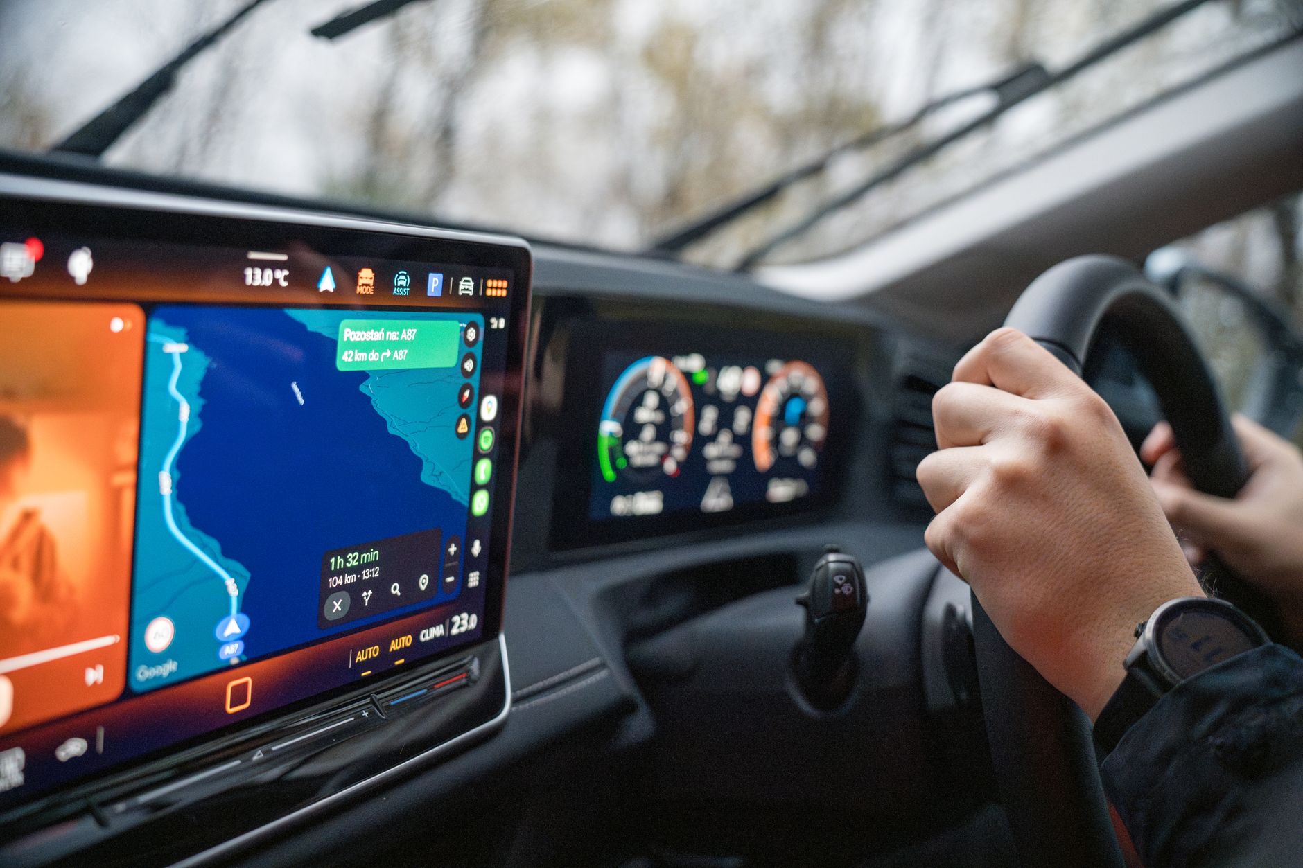 Dedicated sat nav mounted on car dashboard — sat nav vs phone navigation UK comparison